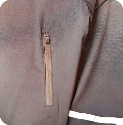 Close-up of a black jacket with a zipper on a plain background